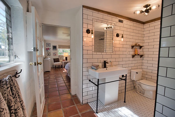 Step into your sleek, modern bathroom with classic white subway tile, a chic floating sink, and a spacious walk-in shower that makes getting ready feel like a treat.