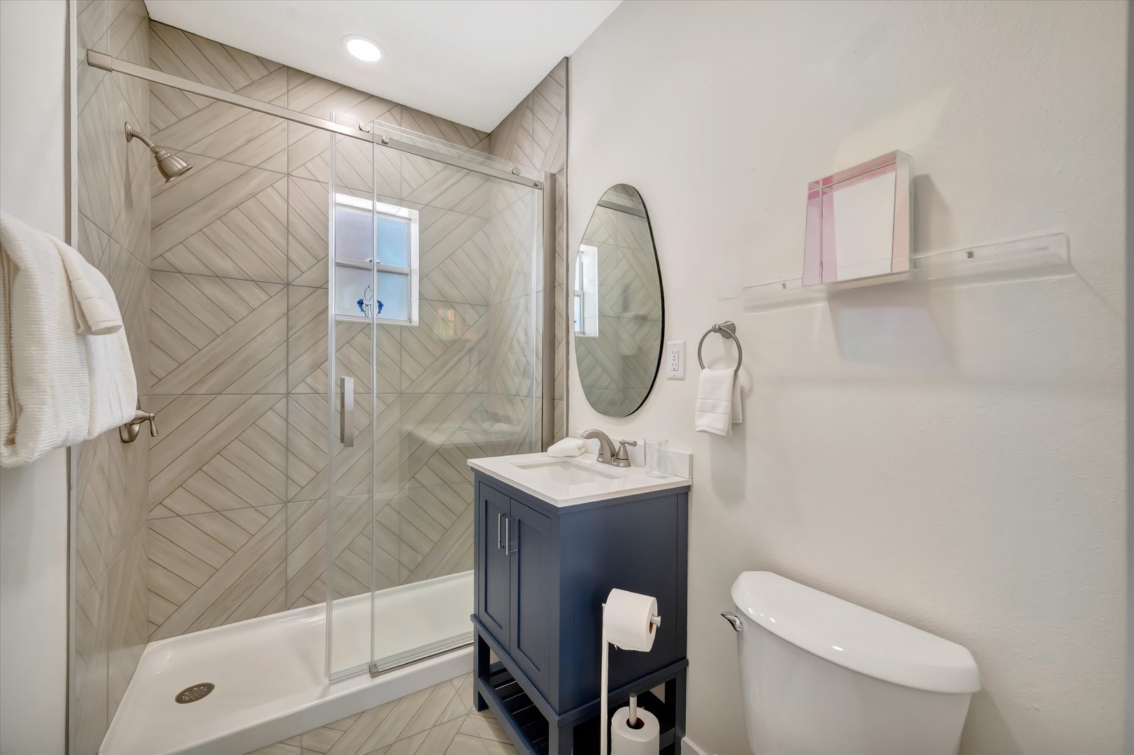 Step into your beautifully refreshed bathroom, where coastal charm meets modern comfort. A spacious walk-in shower awaits you, while elegant finishes and thoughtful touches ensure every moment feels relaxing and special.