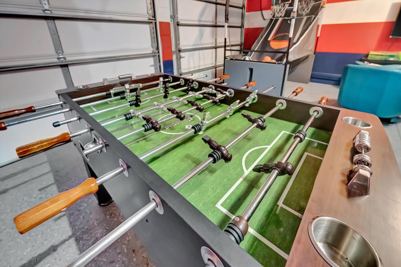 Challenge friends to a game on the foosball table, where friendly competition and laughter await in your game room.