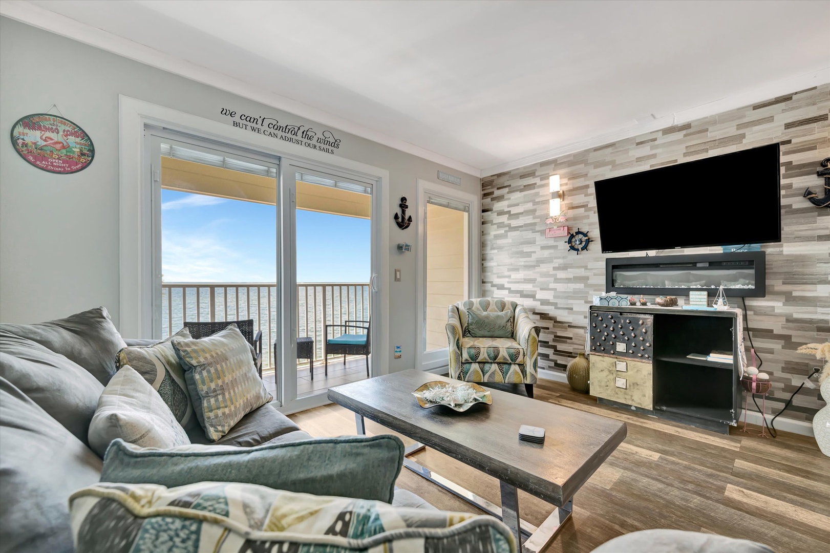 Settle in and let the ocean breeze wash over you in this coastal-chic living room. Plush seating, beach-inspired décor, and sliding doors open to your private balcony with stunning views.