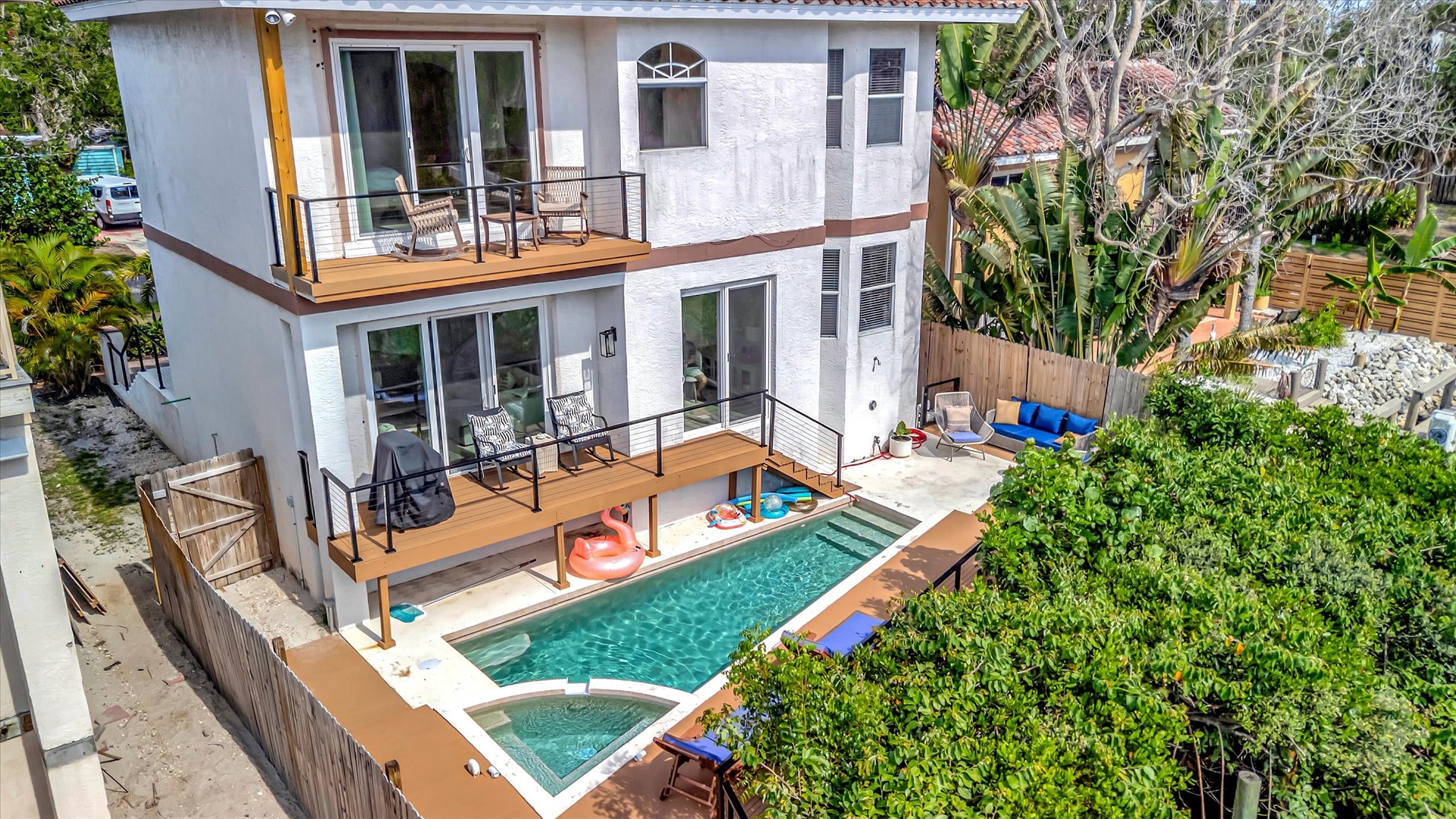 Modern vacation home nestled in lush tropical surroundings with private pool and spacious multi-level terraces for relaxation.