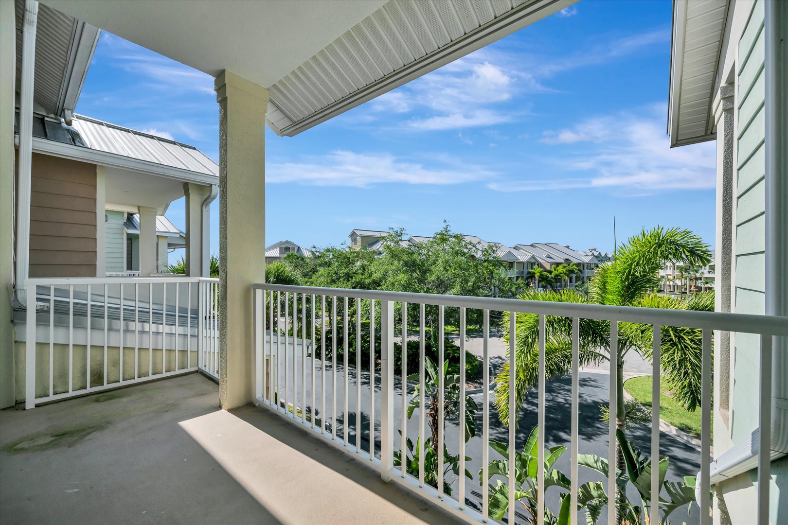 Step onto your private balcony and breathe in the fresh air as you take in views of lush greenery and the peaceful neighborhood below.