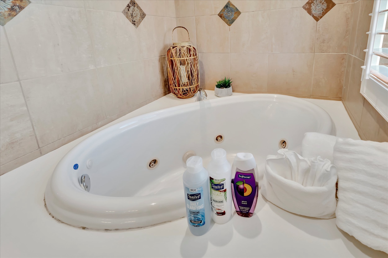 Sink into this luxurious jetted tub surrounded by warm tiles and thoughtful touches. Plush towels and bath essentials await—your perfect escape after a day of adventure.
