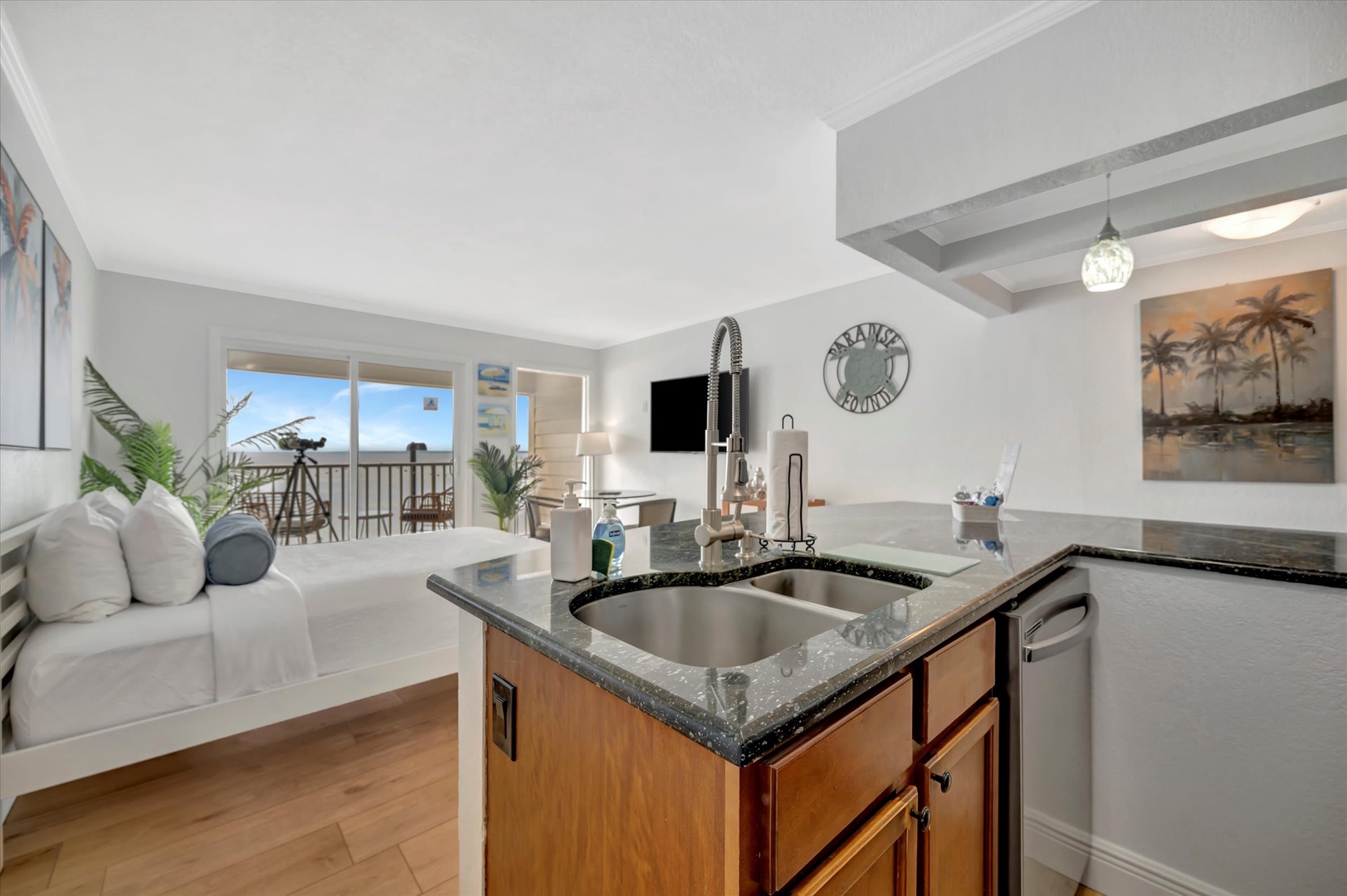 Bright open-concept living where your kitchen flows seamlessly into the lounge area. Prepare meals at the sleek granite-topped island, then step through the patio doors to enjoy your morning coffee outdoors.