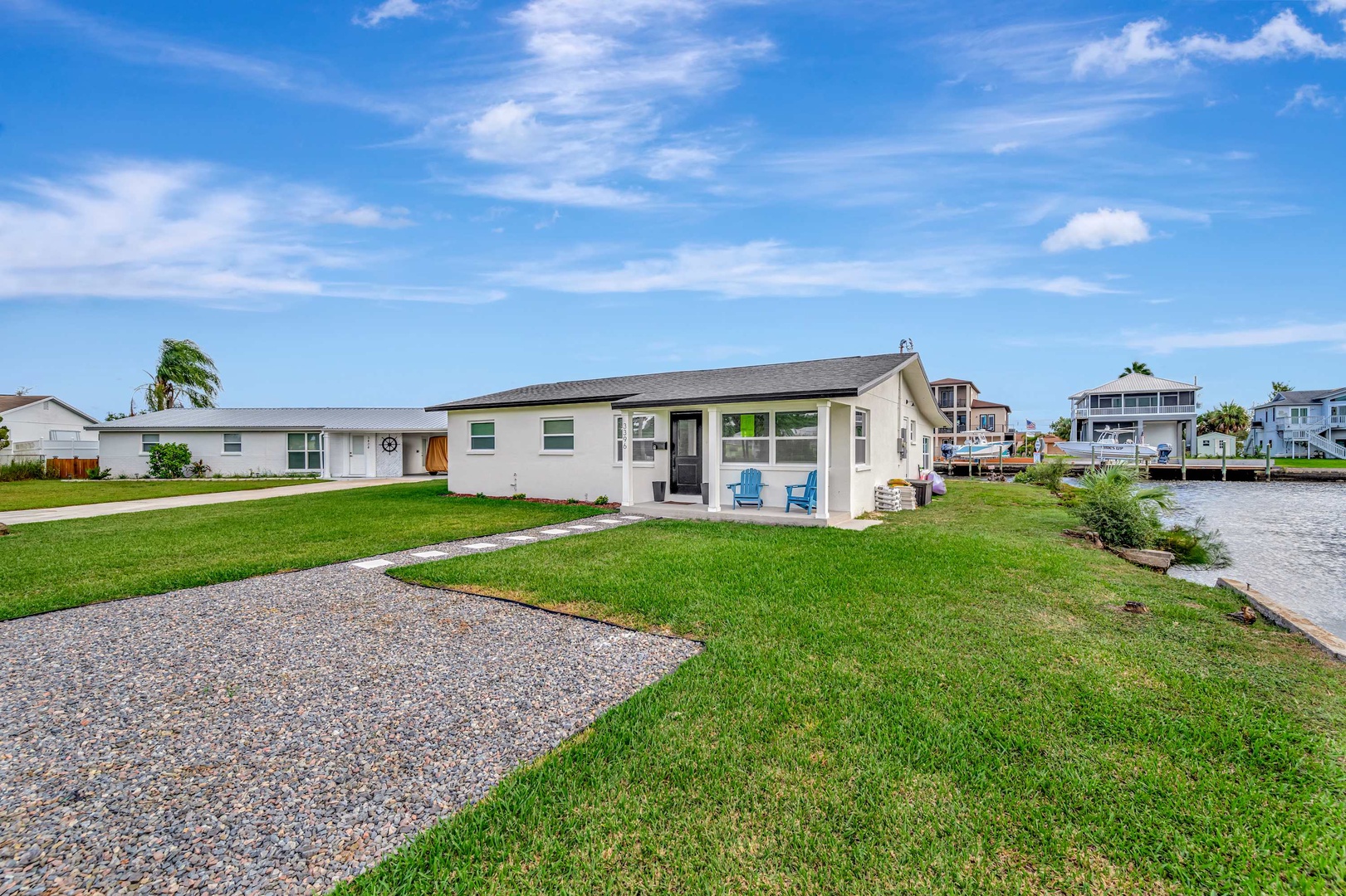 This charming waterfront property offers peaceful canal views and a spacious yard, just moments from the water. A perfect coastal retreat to call home during your stay.