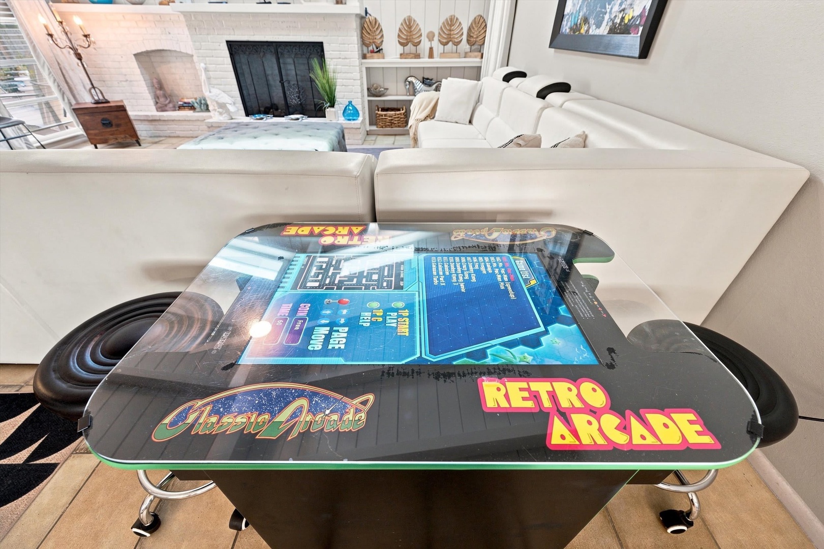 Gather around the retro arcade table for game nights that blend nostalgia with modern comfort. The plush seating and bright, open living space create the perfect atmosphere for friendly competition and relaxation.