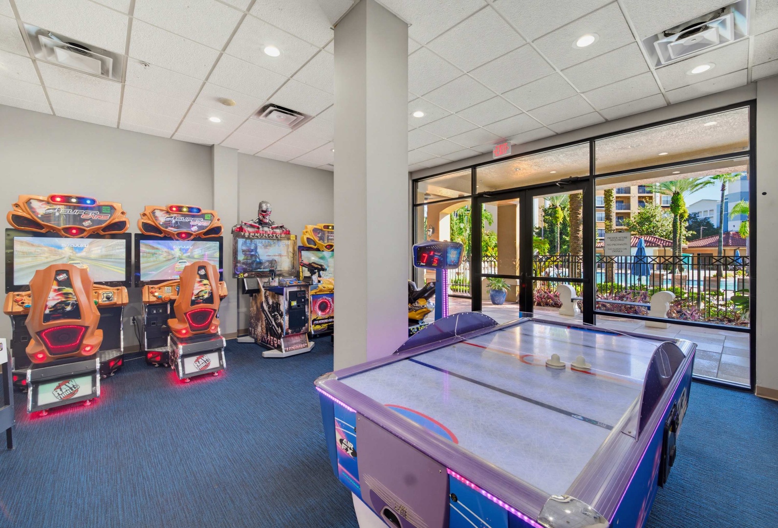 The game room features an air hockey table and racing simulators, perfect for friendly competition during your stay.