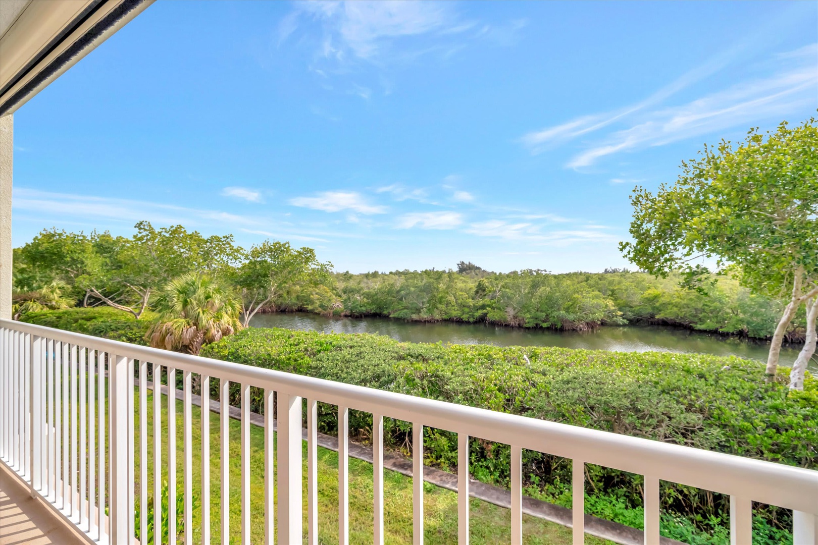 Step onto your private balcony and soak in serene waterway views framed by lush mangroves and open skies—a peaceful escape where nature greets you every morning.