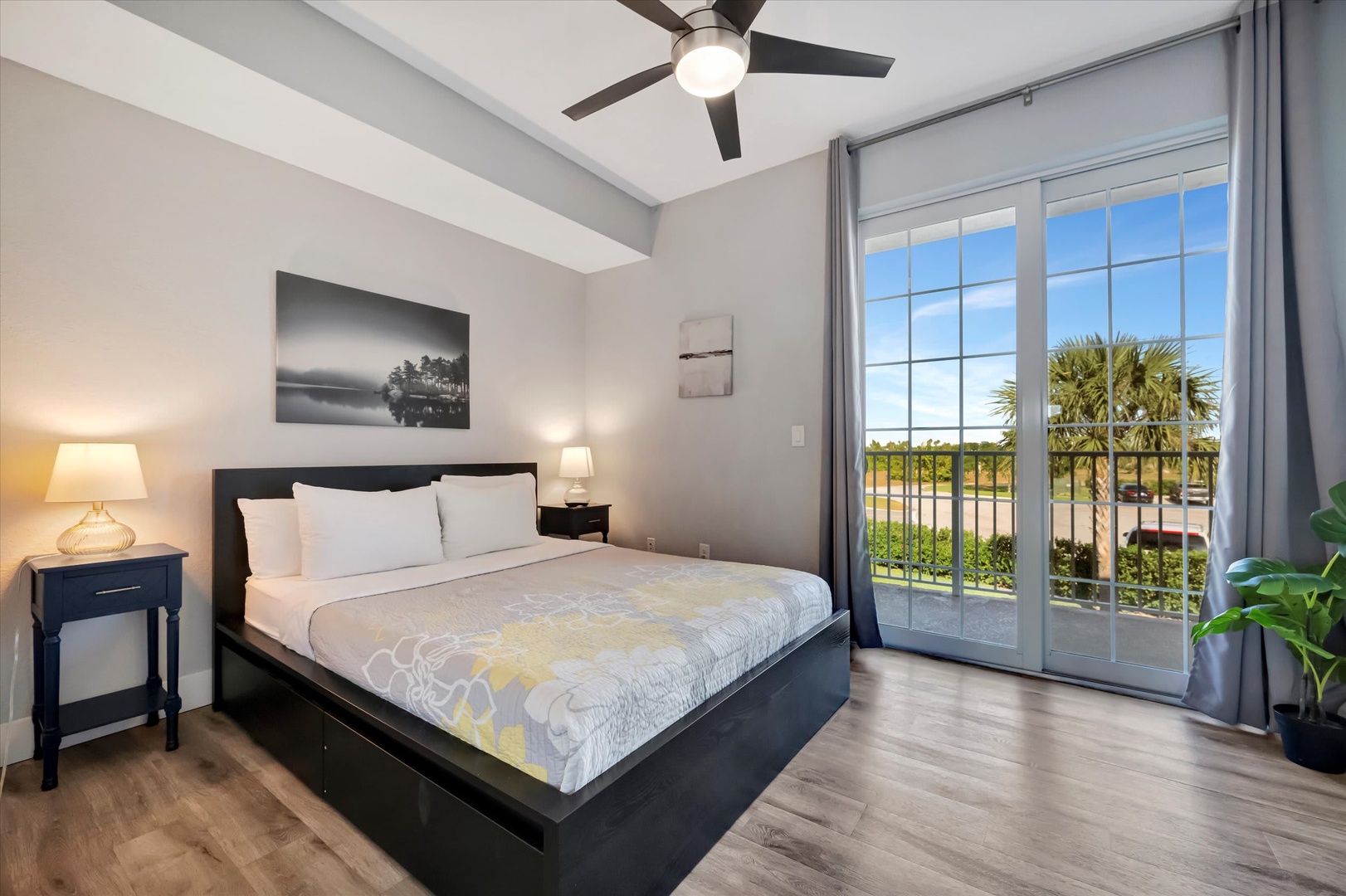 Step into your bright bedroom where crisp white linens and soothing gray tones create a peaceful retreat. Open the French doors to your private balcony and take in the palm-lined views.