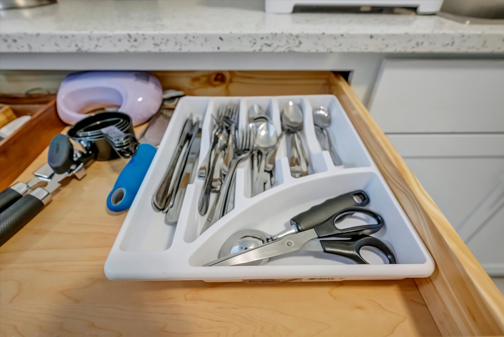 Your kitchen is fully stocked with everything you need, from sharp knives to utensils—ready for home-cooked meals or quick snacks during your stay.