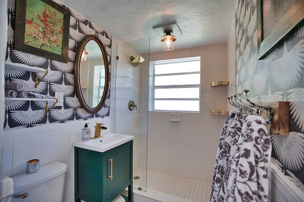 Step into your stylish bathroom featuring a chic tiled shower, sleek vanity, and modern fixtures—a perfect space to refresh and unwind.