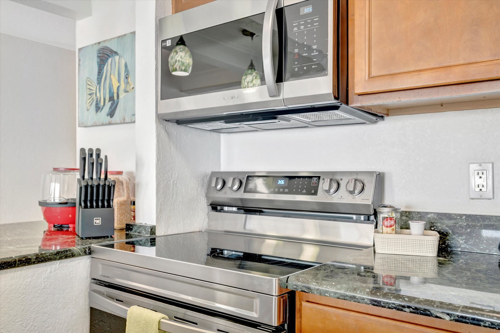 Your fully equipped kitchen features modern stainless steel appliances and everything you need to whip up a delicious home-cooked meal during your stay.