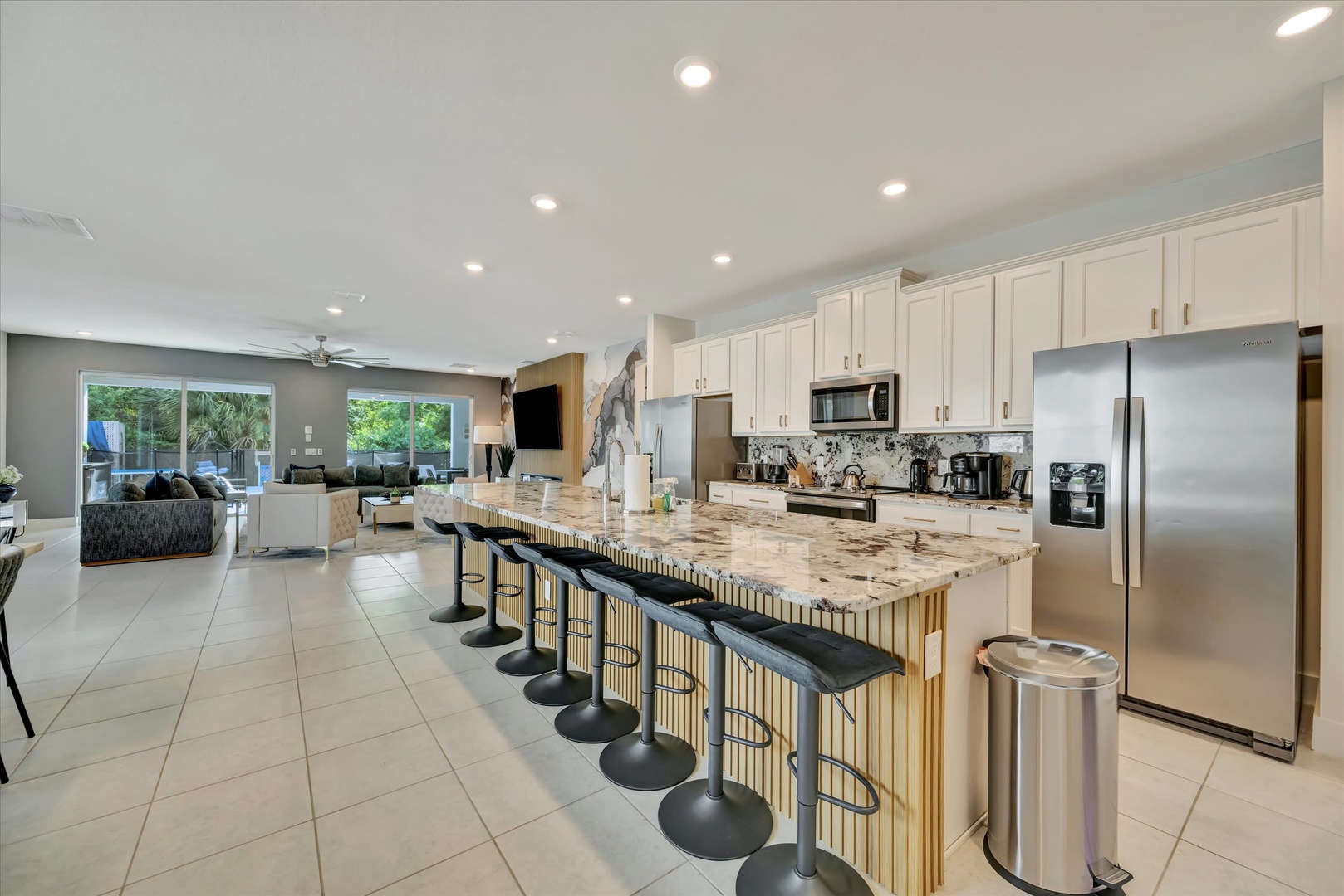 Your gourmet kitchen awaits with gleaming granite countertops, modern appliances, and a spacious island perfect for morning coffee or gathering with friends.