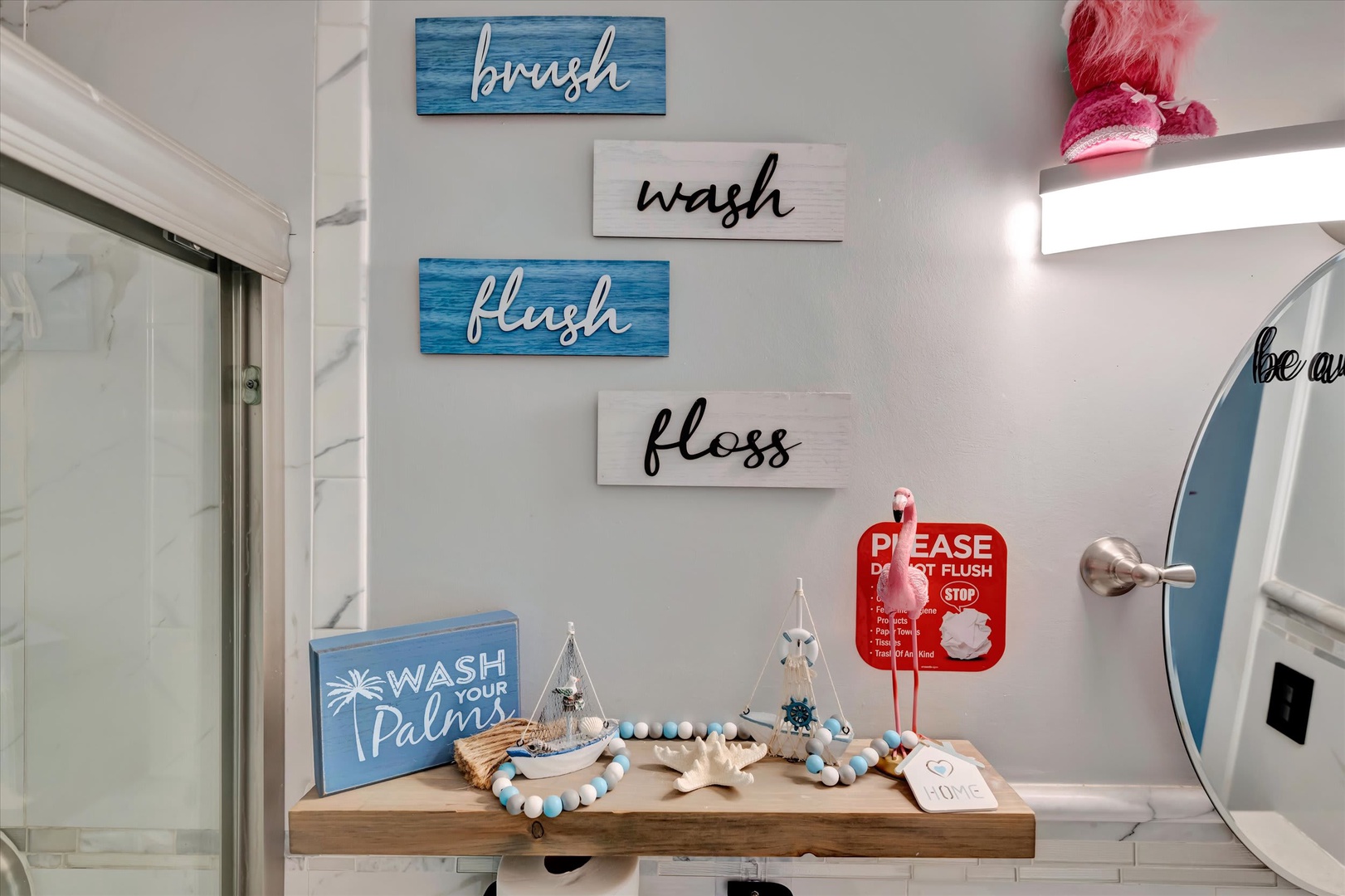 Step into your coastal-inspired bathroom with beach-themed décor and playful touches that invite you to relax and refresh.