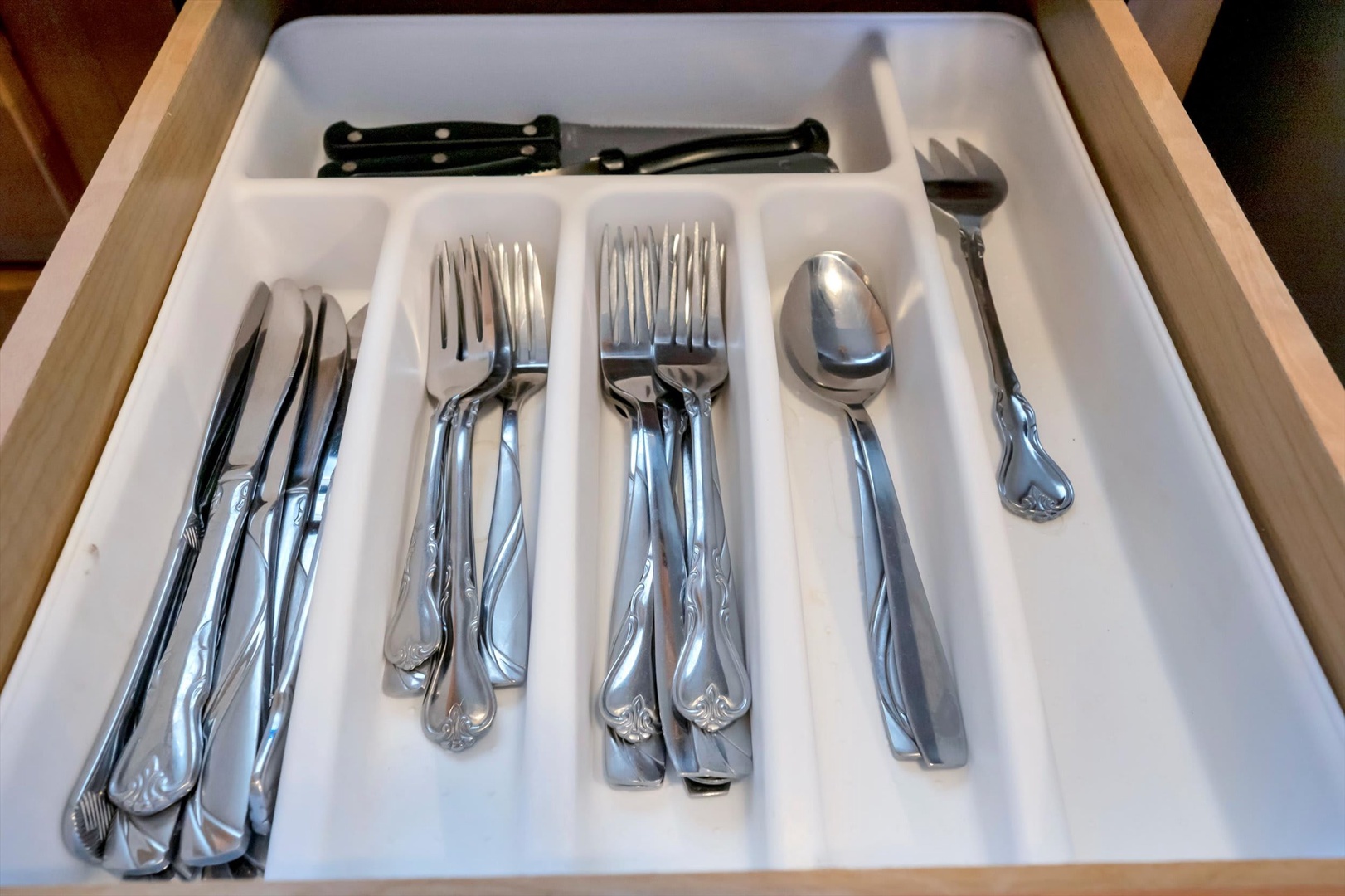 Your kitchen drawer is thoughtfully stocked with elegant silverware and serving pieces, making meal prep and dining feel effortless and refined during your stay.
