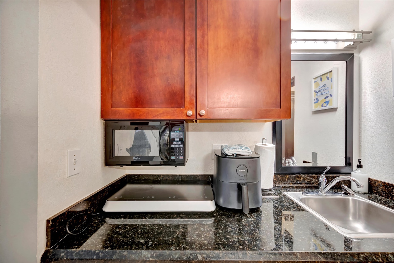 Cook your favorite meals with ease in your fully equipped kitchenette, complete with granite counters, modern appliances, and everything you need for a comfortable stay.