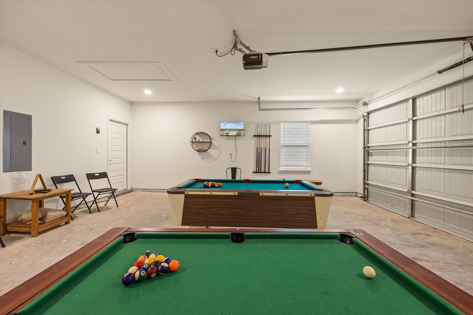 Challenge your crew to a friendly match in your private game room with two pool tables, perfect for laid-back competition and evening fun together.