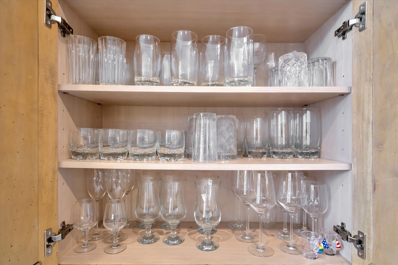 Your kitchen is stocked with everything you need—glassware for every occasion, from morning coffee to evening wine, all neatly organized and ready for you.