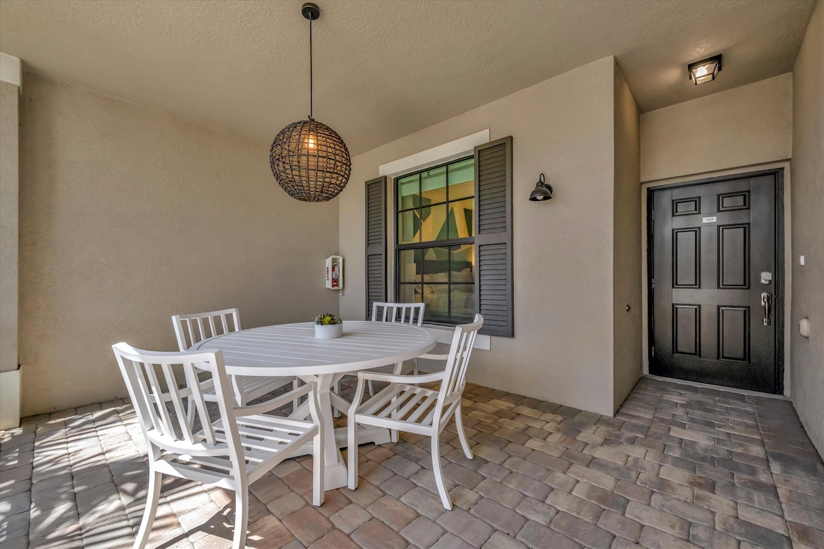 Your covered patio offers a welcoming spot to gather for meals, with charming lighting and a fresh outdoor ambiance that makes every breakfast or dinner feel special.