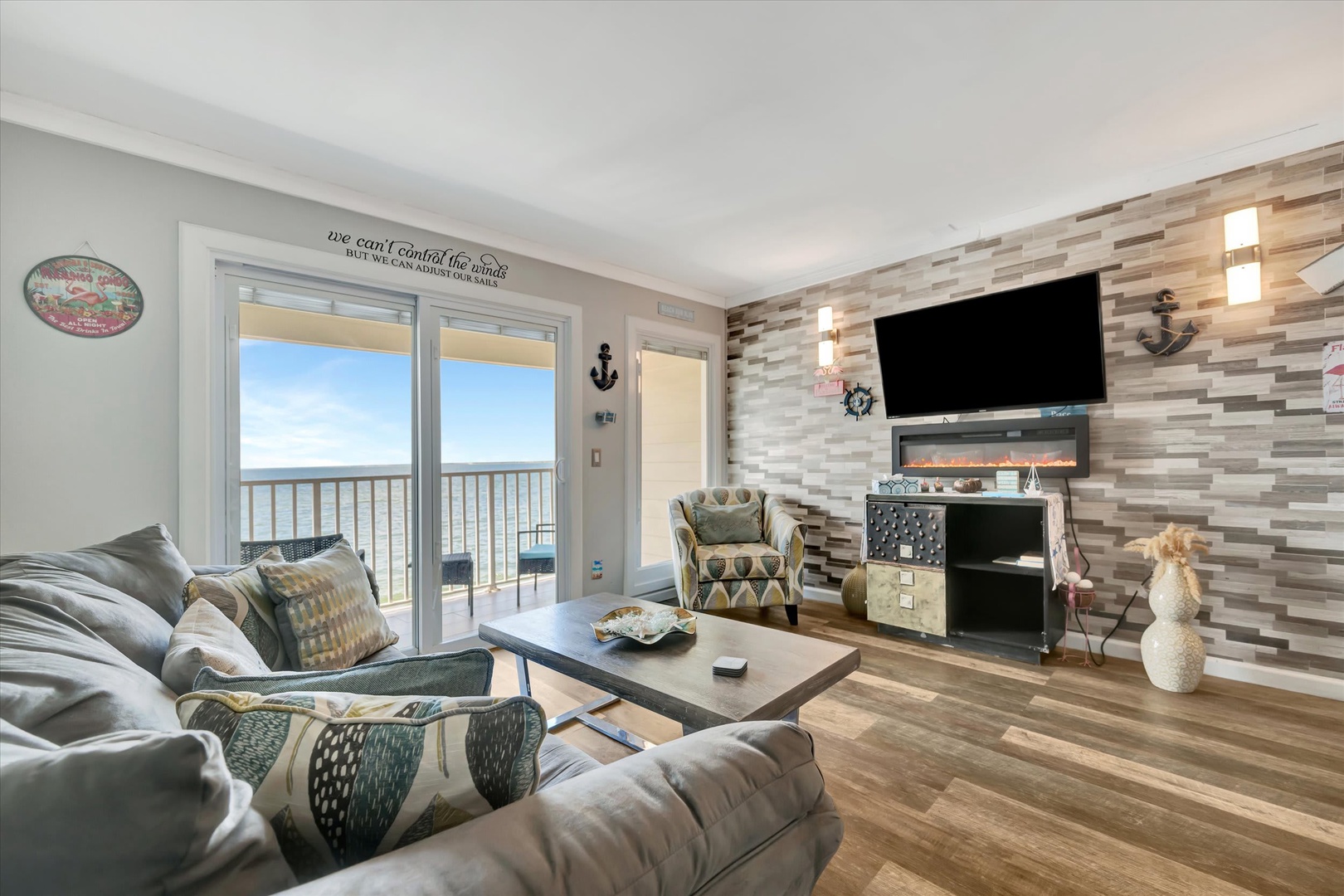 Settle into your private oceanfront retreat, where comfortable seating and a cozy fireplace set the stage for relaxing evenings watching the waves roll in through floor-to-ceiling glass doors.