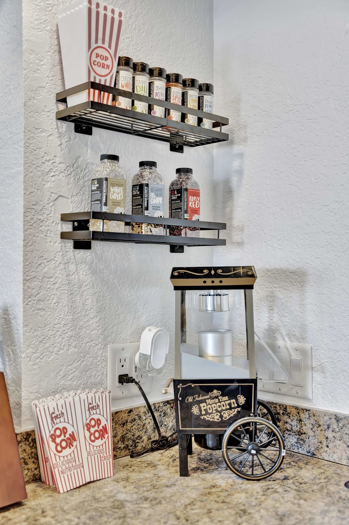 Gather round for movie night with your very own popcorn station, complete with a vintage-style popper and a selection of savory seasonings to make every snack your own.