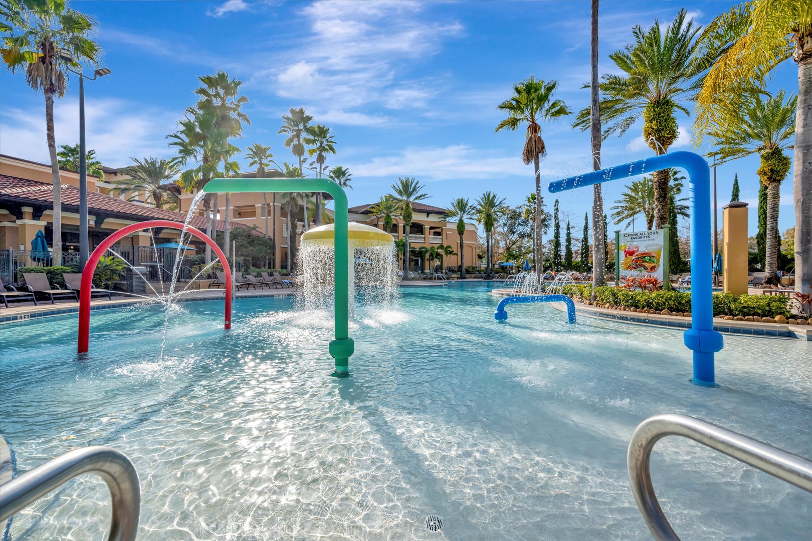 Splash zone fun with water features and sunny skies—perfect for cooling off and making memories under swaying palms.
