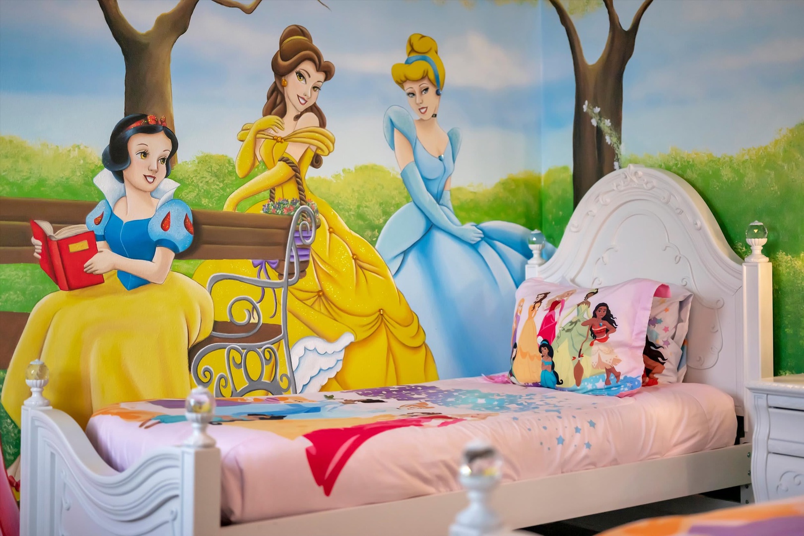 This whimsical bedroom features a fairytale-themed mural and charming décor perfect for young ones' storybook dreams.