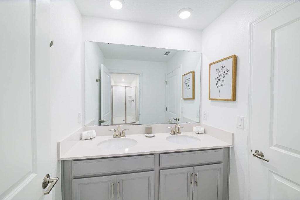 Step into your beautifully updated bathroom, where dual sinks and gleaming countertops make getting ready effortless. Soft lighting and a calming palette create a spa-like retreat just for you.