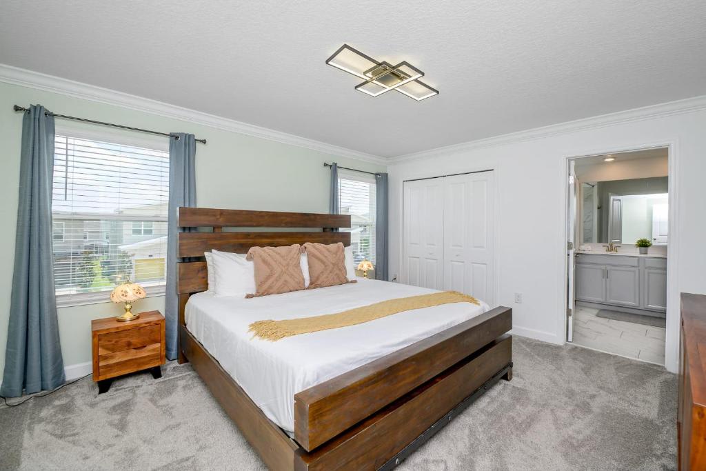 Unwind in your serene bedroom with a plush king bed, modern lighting, and a private en-suite bathroom just steps away for your comfort.