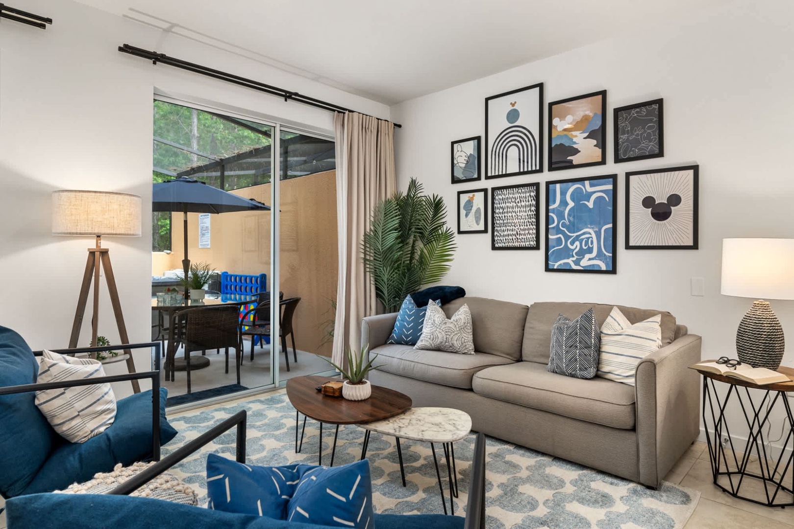 Sink into plush seating surrounded by modern art and natural light. Your private patio awaits just beyond the glass doors, perfect for morning coffee or evening relaxation.