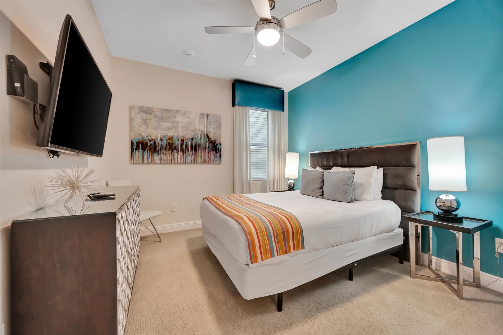 Relax in your bright bedroom with stylish accents and a plush bed dressed in crisp linens and a vibrant runner—your peaceful retreat after a day of adventure.