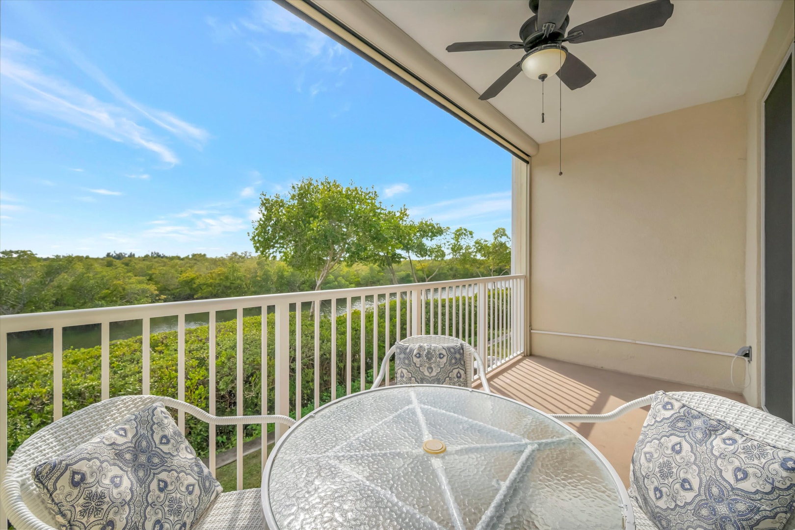 Sip your morning coffee on your private balcony, gazing out over lush treetops and peaceful natural surroundings. The ceiling fan keeps you cool while you unwind in comfort.