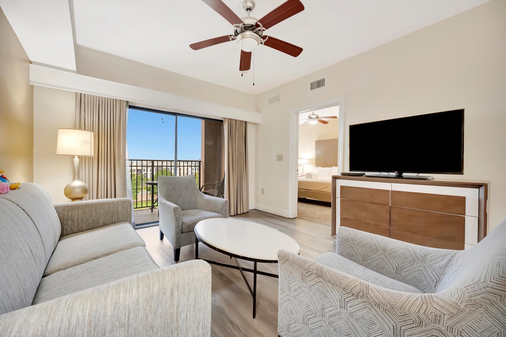 Relax in your bright, airy living room with soft seating, a ceiling fan to keep you cool, and your own private balcony where you can enjoy warm weather and views.