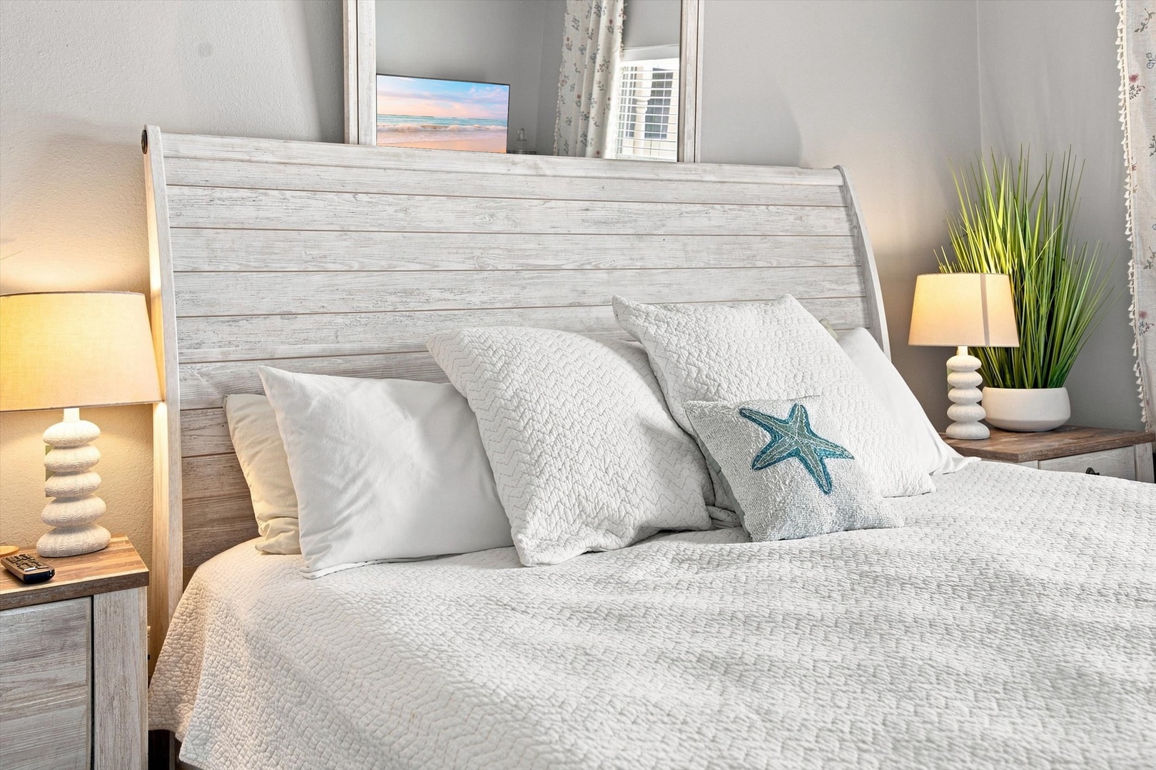 Sink into crisp white linens and plush pillows after a day of exploring. Your peaceful coastal-inspired bedroom invites you to unwind and recharge in style.