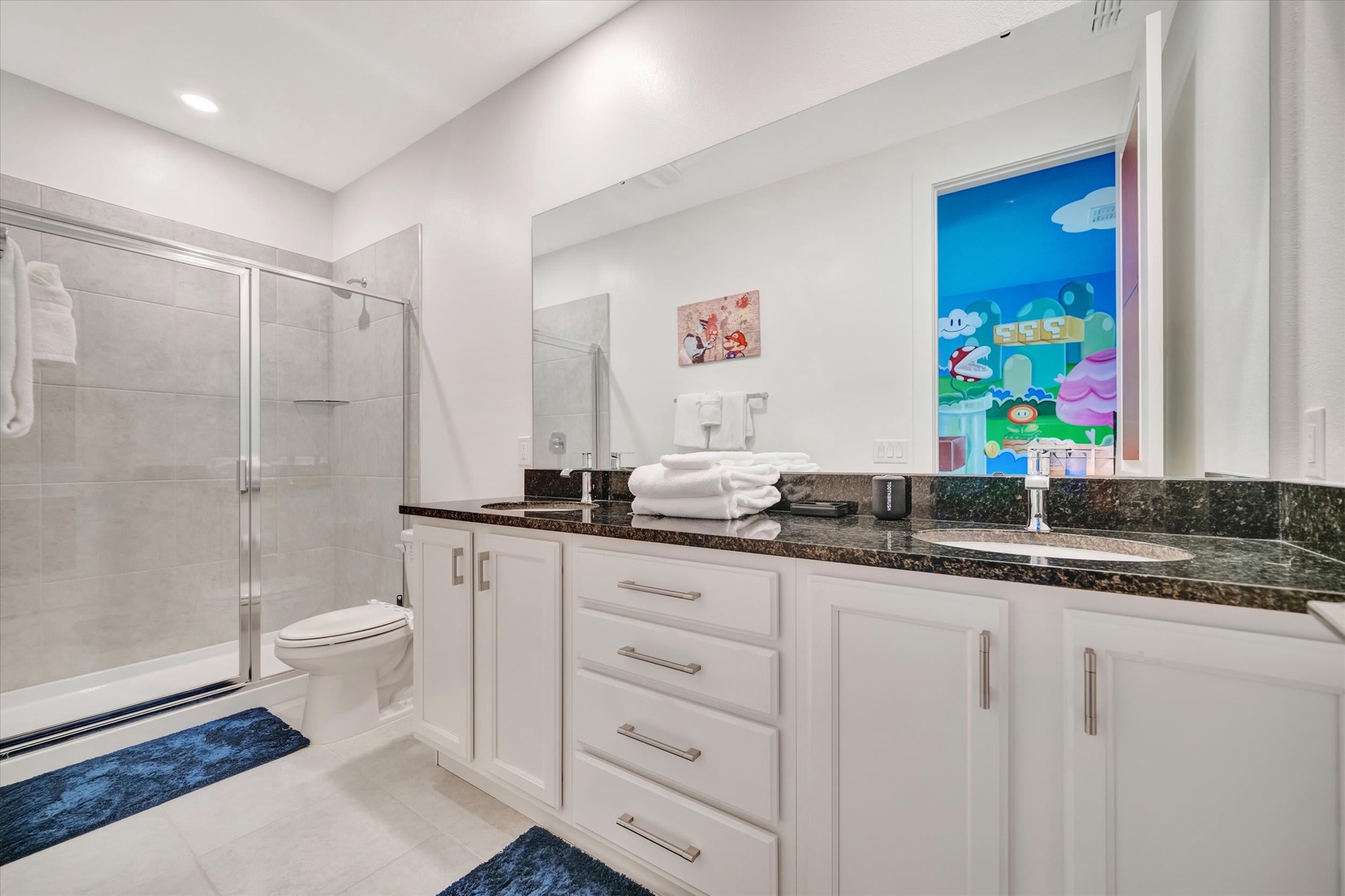 Step into your bright, spotless bathroom with granite counters and plush towels ready for you. The walk-in shower and thoughtful storage make every morning feel effortless.