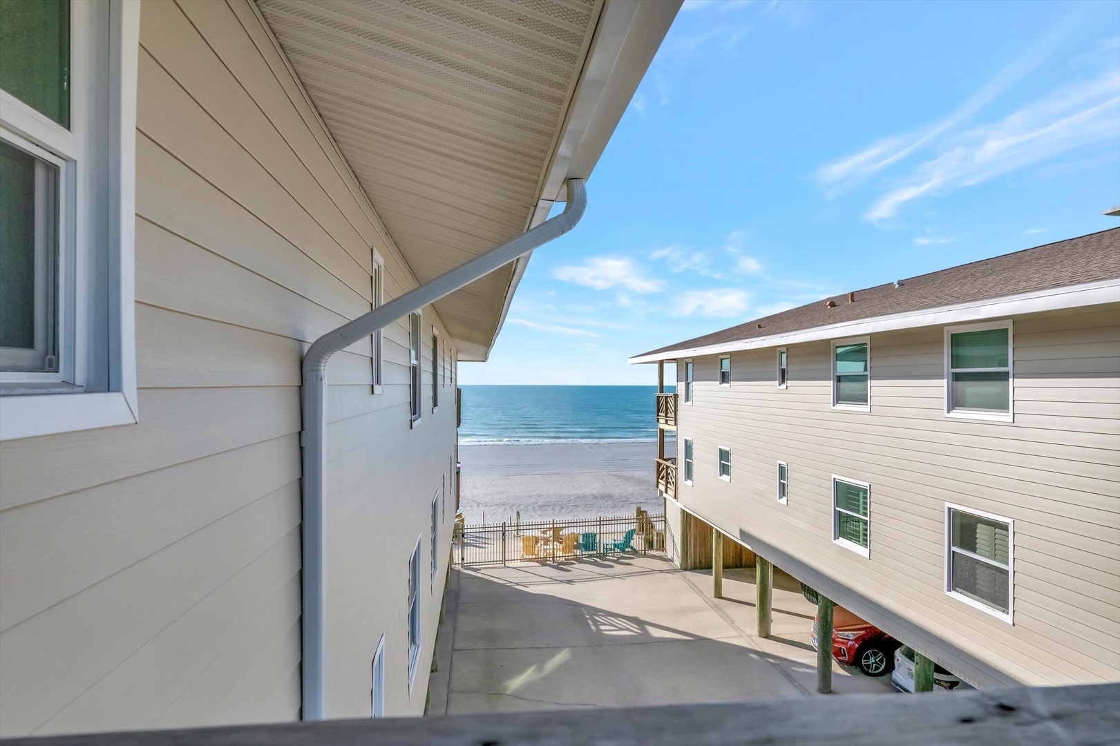 This beachfront property offers a peaceful coastal setting with direct access to the sandy shore and ocean views from the property.