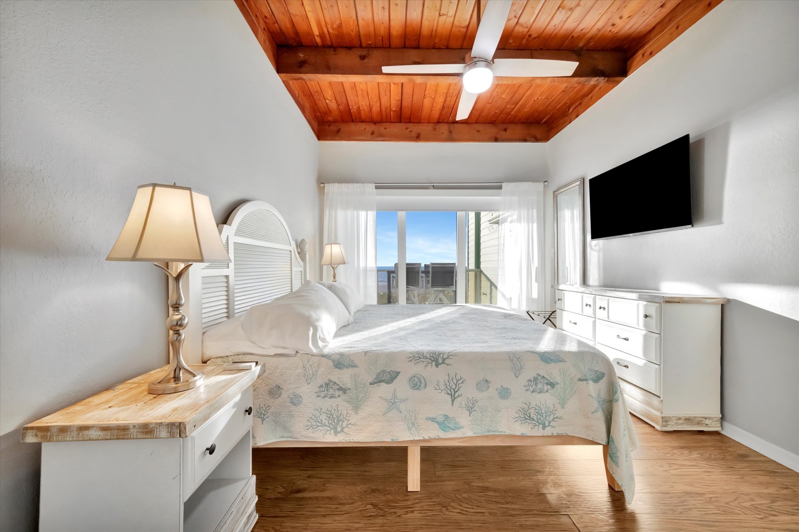 Wake up beneath the warmth of natural wood ceilings and let your gaze drift to ocean glimpses beyond. Your coastal escape feels light, airy, and ready to restore you.