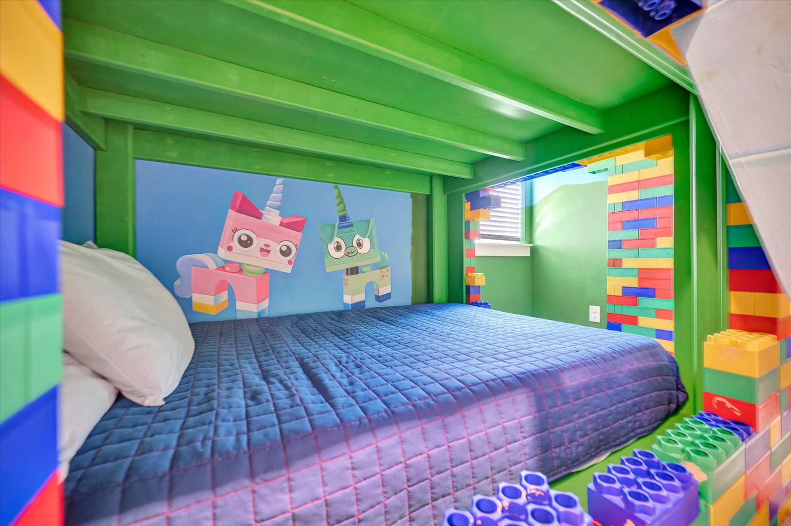 Your kids will love dreaming in this vibrant play-themed bedroom, complete with colorful block décor and playful characters that spark imagination at every turn.