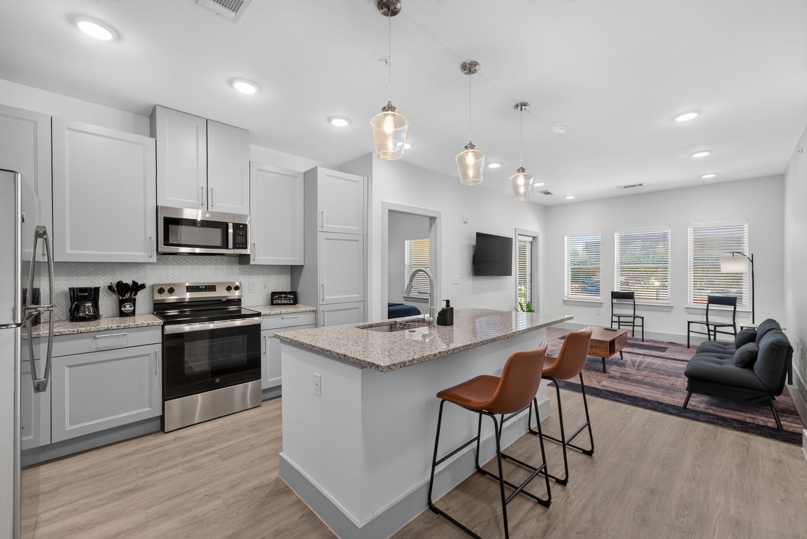 Step into your modern open-concept haven where the bright kitchen flows seamlessly into the cozy living area—perfect for gathering, cooking, and unwinding in style.
