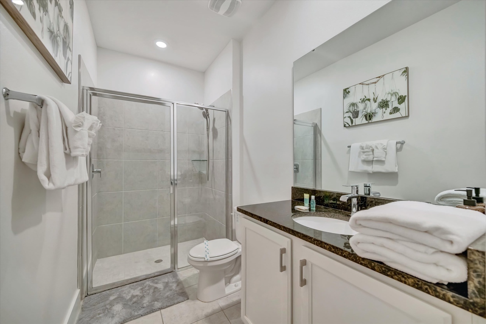Step into your private spa-like retreat, where fresh towels await and a walk-in shower invites you to unwind after a day of adventure.