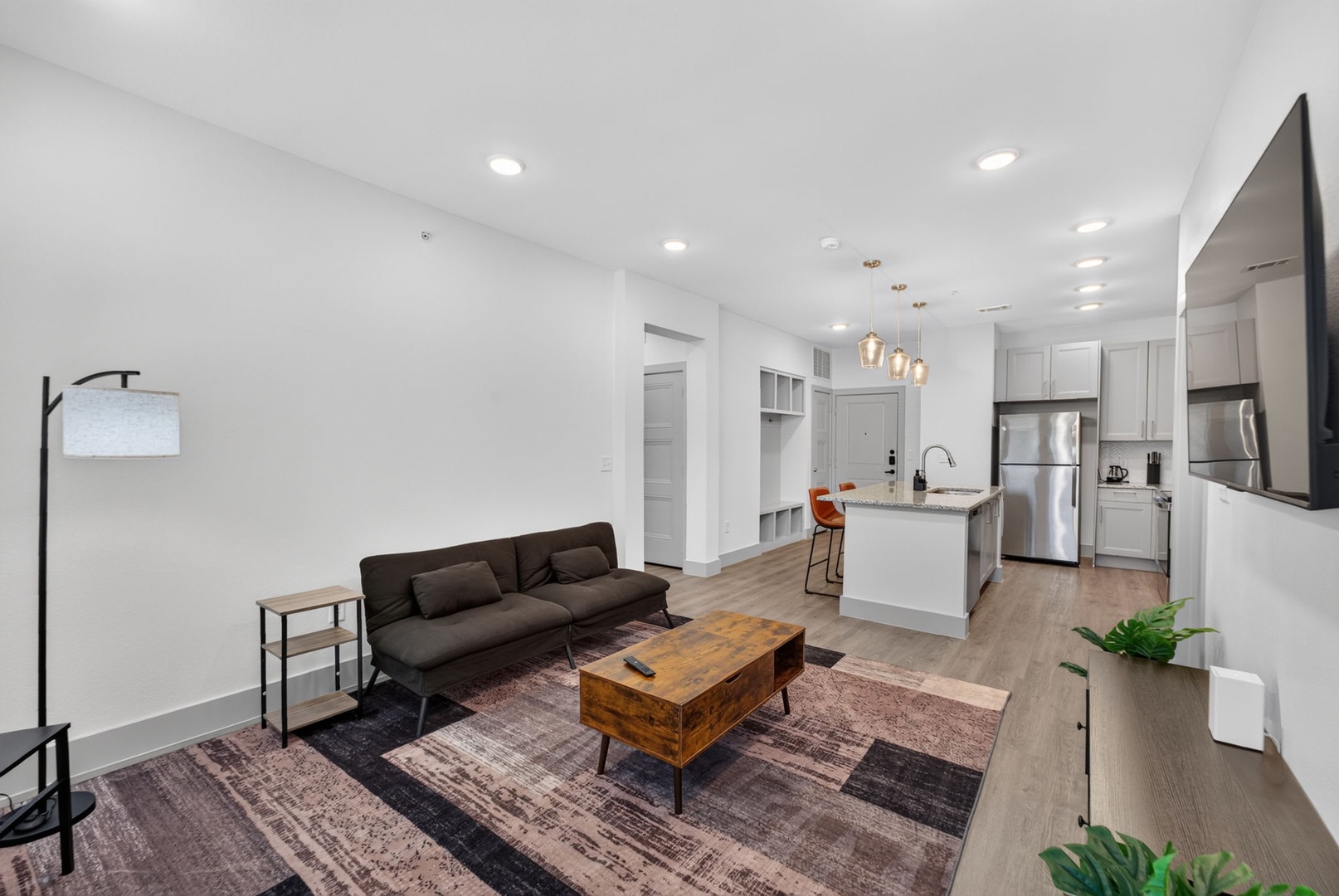 Step into your bright, open-concept retreat where modern design meets home comfort. Settle into the stylish living area, cook in your sleek kitchen with stainless appliances, and enjoy the airy flow of this contemporary space.