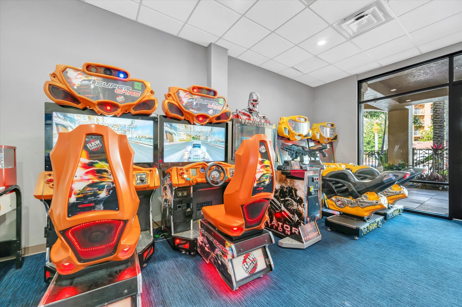Challenge yourself to a friendly racing competition in this vibrant game room, featuring immersive driving simulators and cutting-edge arcade entertainment for hours of indoor fun.