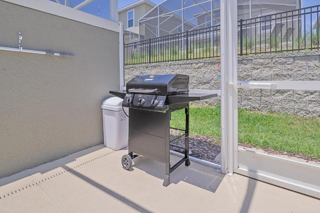 Your screened patio opens to a private backyard, complete with a gas grill ready for sunny cookouts on the lawn.