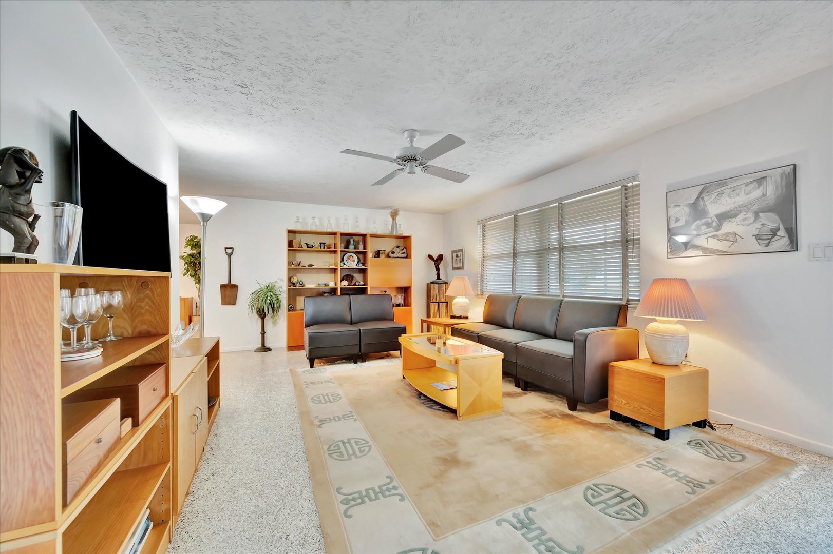 Settle into your thoughtfully appointed living space, where comfortable seating and warm wood tones create a welcoming retreat after your day's adventures.