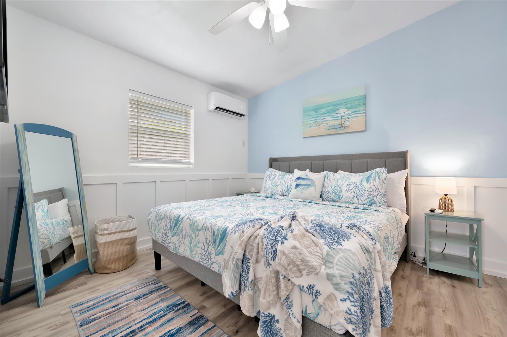 Rest easy in your coastal-inspired retreat with soft linens, cool ocean hues, and modern comfort. The bright space with ceiling fan and air conditioning ensures your perfect night's sleep.