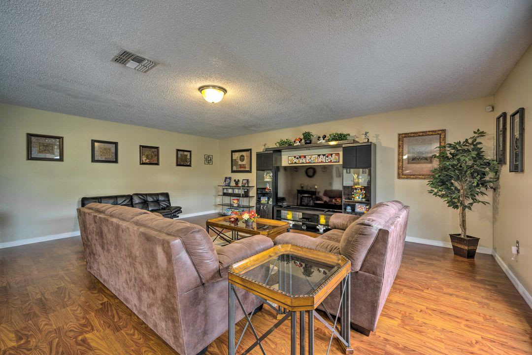 Unwind in your spacious living room, where comfortable seating and warm tones create the perfect spot to relax after a day of adventure.