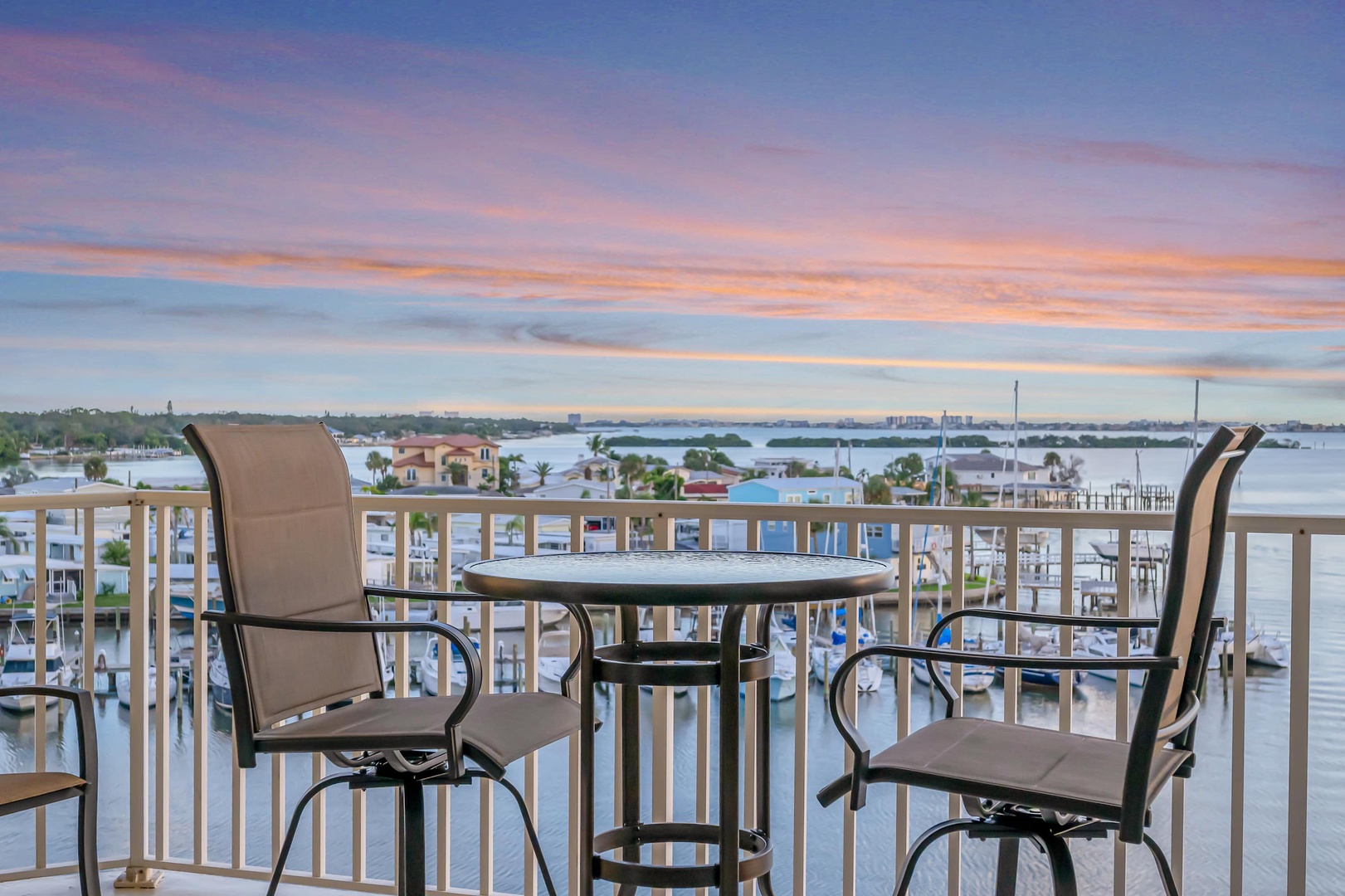 Sip your morning coffee as you take in the stunning waterfront views and colorful sunrise from your private balcony. Watch boats drift by and let the peaceful scenery set the tone for your day.