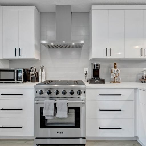 Your fully equipped kitchen features sleek stainless steel appliances and ample counter space—perfect for preparing meals during your stay.