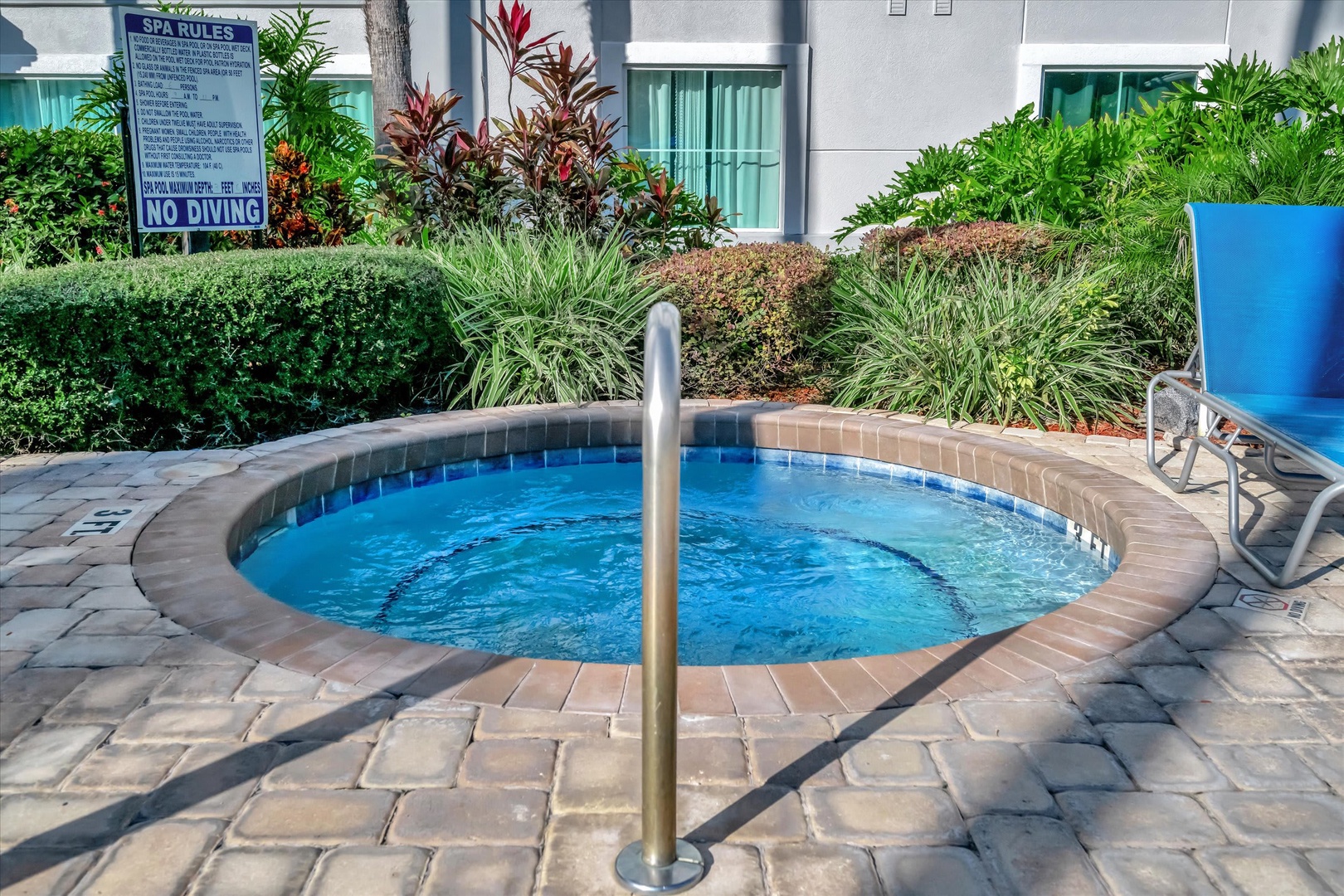 Slip into the bubbling warmth of your private hot tub, surrounded by tropical greenery and sunshine—a perfect spot to unwind after exploring the area.