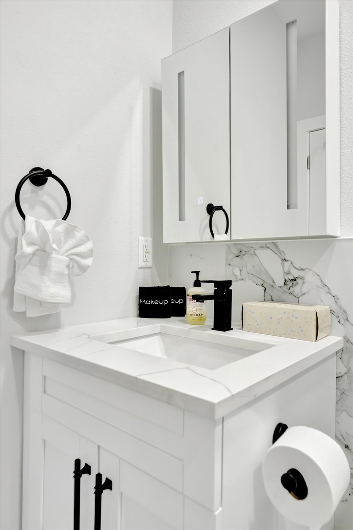 Step into a pristine retreat where marble accents meet modern elegance. Fresh towels, luxury soap, and thoughtful details await your arrival—everything prepared for your comfort.